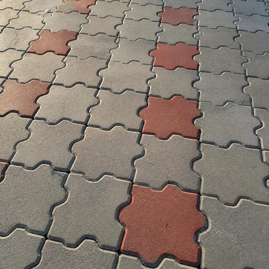Adoquín cruz mitad corta 12x22x10 cm — pavimento con piezas entrelazadas